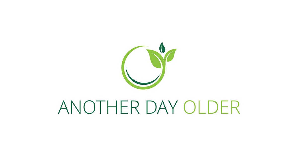 Logo with a green circular design incorporating two leaves and the text "ANOTHER DAY OLDER" in green and light green, representing an aging curriculum.