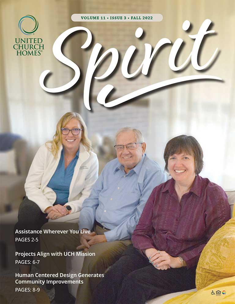 Cover of Spirit magazine Fall 2022 issue featuring three smiling people, two women and one man, sitting on a couch with "Assistance Wherever You Live," "Projects Align with UCH Mission," and other highlights from the senior living blog.